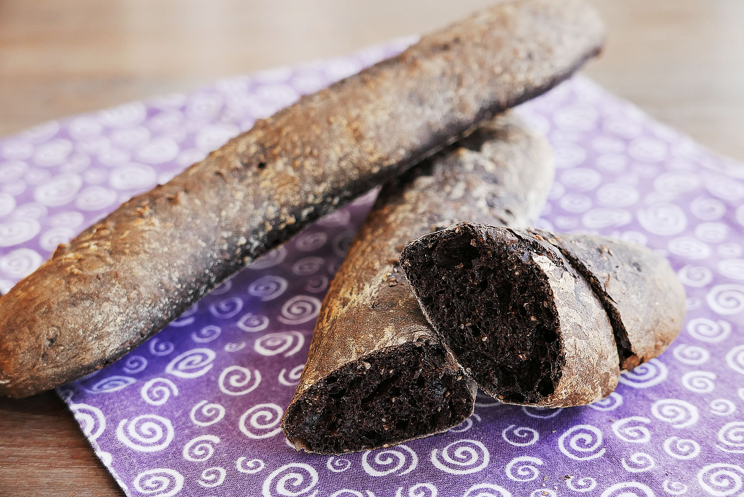 Black baguette made with black cocoa powder